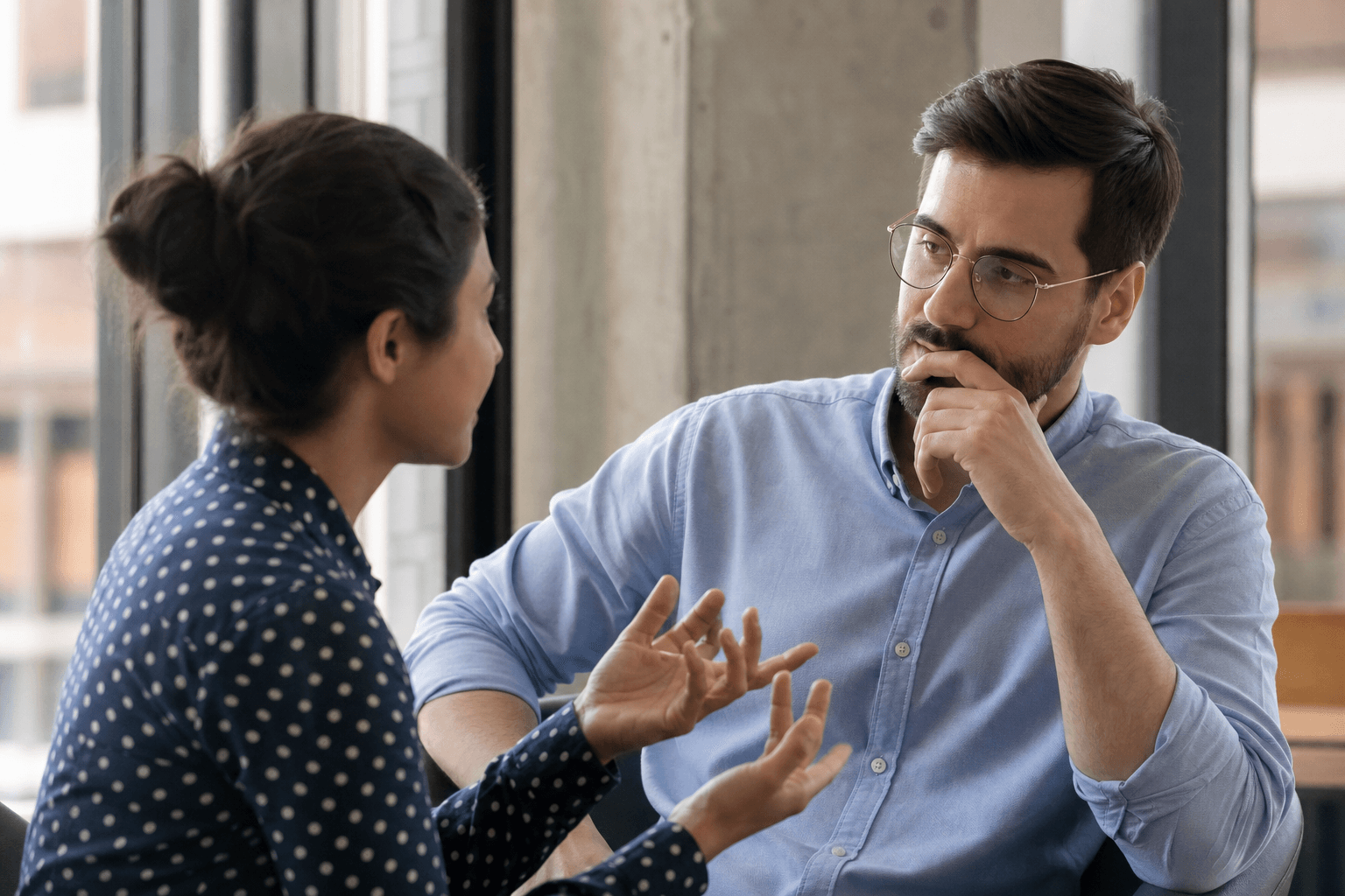 Two colleagues navigating a demanding conversation with care
